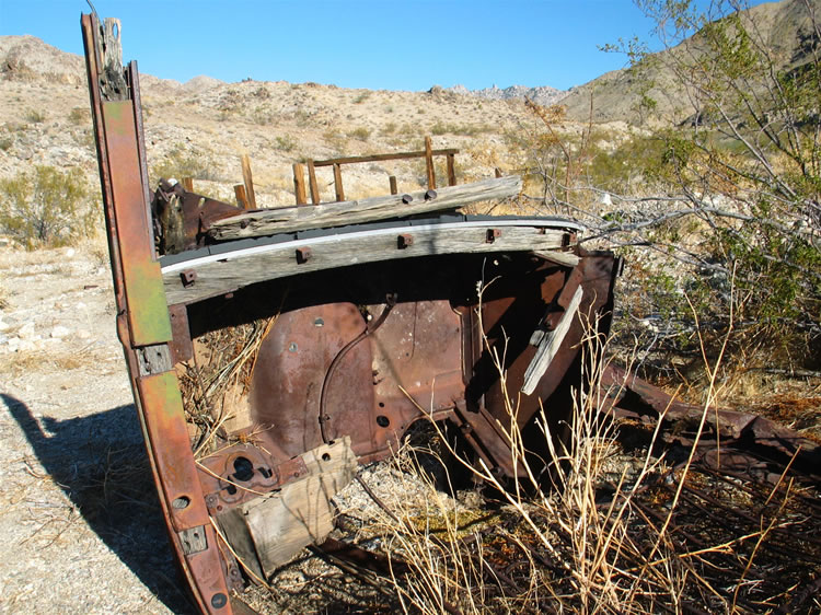 The use of wood frames in the body would indicate a vehicle from around the 1920's.