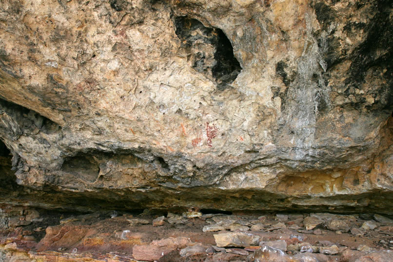 On the underside of the rock overhang are several interesting pictographs, most of which are done in red.