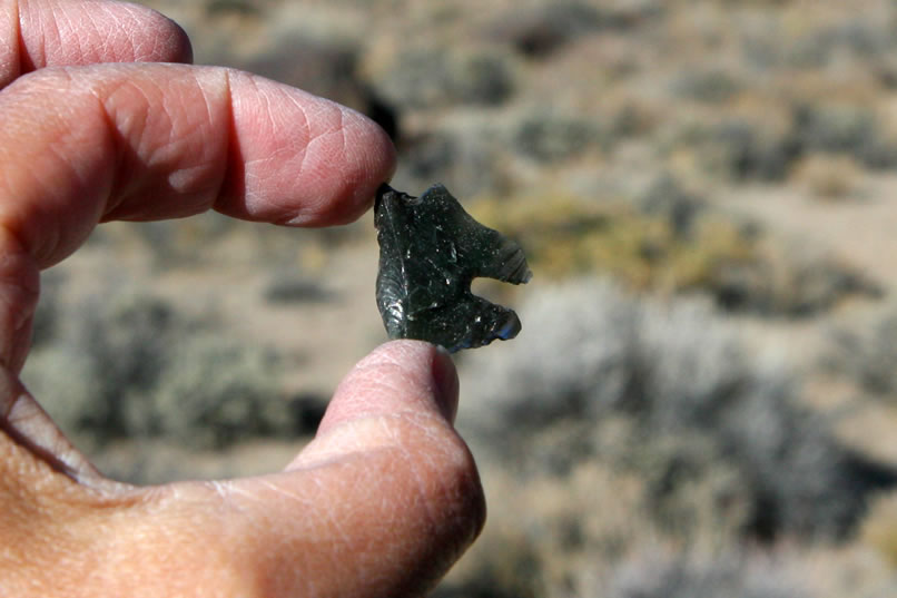 Below the cave, Jamie finds a fragment of a large obsidian point.