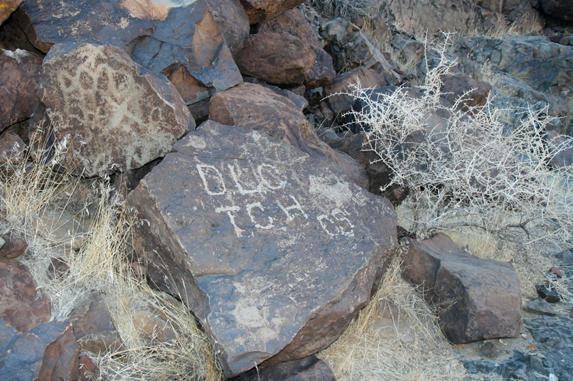 This set of initials, though, dates from 1905 and is placed over some faint petroglyphs.