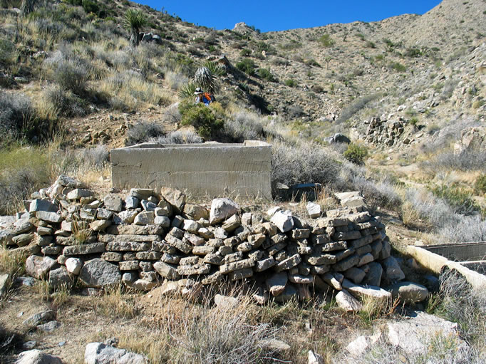 Rock retaining walls protect the ground around the tanks from erosion.