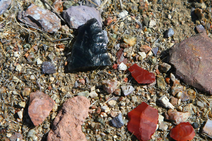 Jamie's radio, as she does some cross country hiking to rejoin Niki, crackles with news of a good find, "Hey, Jamie.  I've just found a broken obsidian point!"