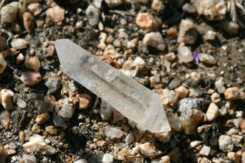 But it soon becomes apparent that Lee Lyons wasn't the first to enjoy this location.  Although it's possible that Lee could have dropped this small doubly terminated quartz crystal here, written accounts seem to indicate that his energies were more focused on working a gold claim "up behind his camp."  So who might it have belonged to?