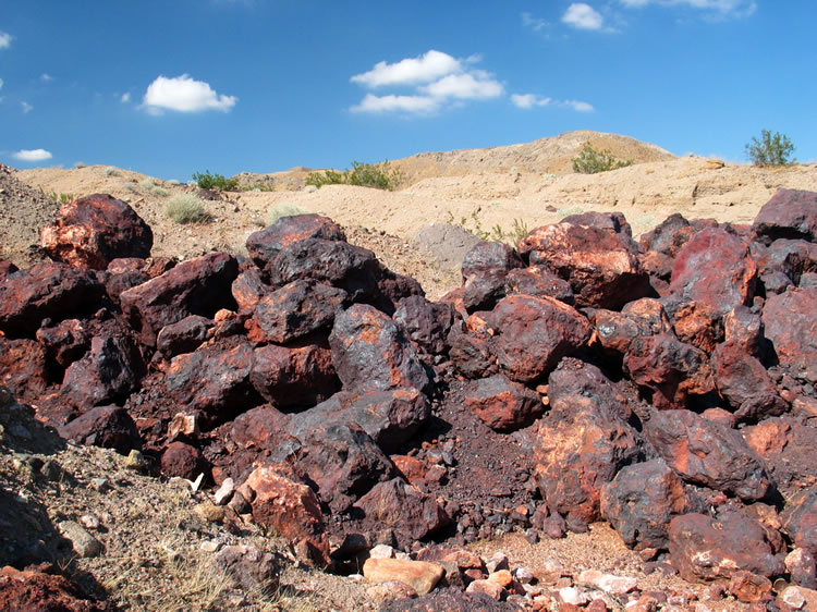 The mines here were all manganese mines.  They extracted pyrolusite, the black metallic manganese ore seen here, from numerous open cuts in the hillsides.