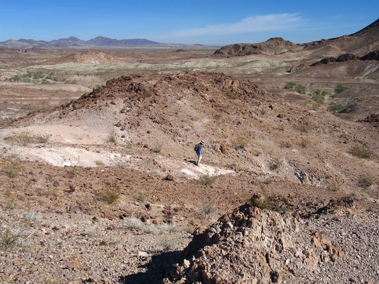 Where the canyon trail rejoins the rock shelter trail, Niki discovers a couple of nice pieces of black agate.