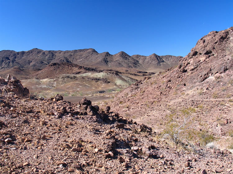 Eventually we recross the saddle and take the trail that you can see on the hillside back to the shelter area.