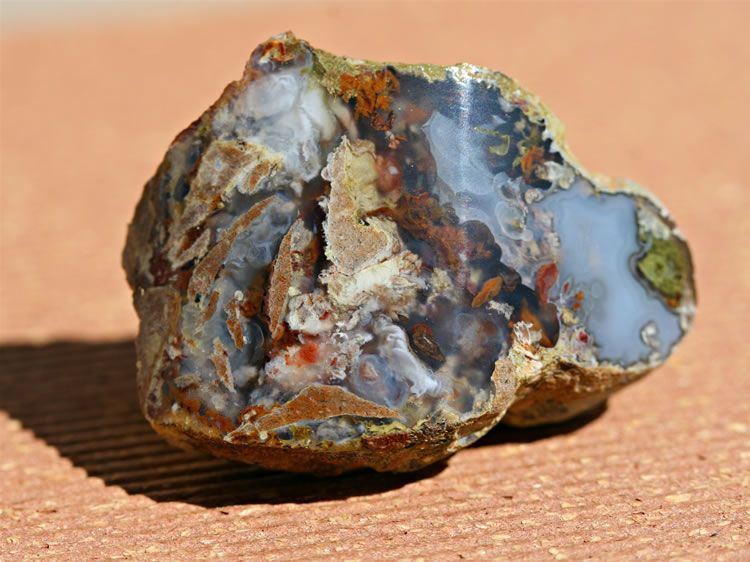 A nice piece of agate with numerous inclusions.