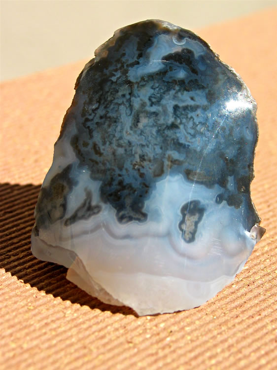 A piece of black agate mixed with milky white chalcedony.