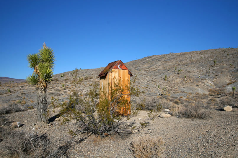 Not far from the cabin is the outhouse.