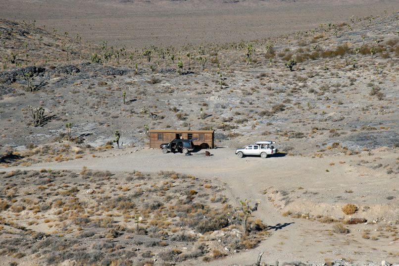 A view of the cabin from a nearby hillside.