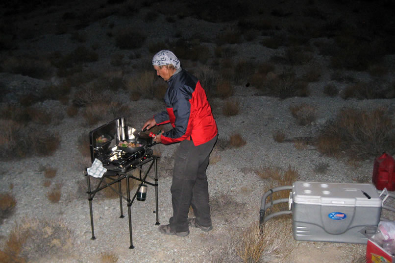 By the time we get camp set up it's totally dark but this doesn't stop chef Jamie from cookin' up some good grub.