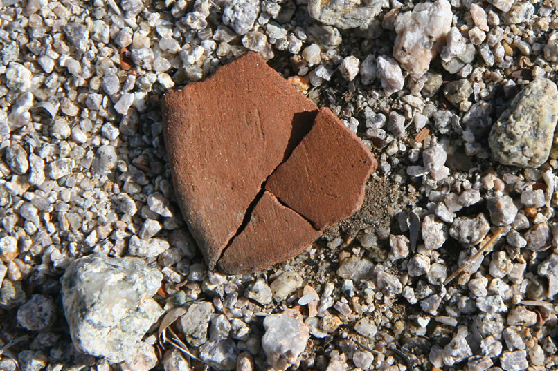 Back in the main wash we once again turn toward the now nearer hills.  Only a few minutes pass before a large piece of fractured pottery is spotted.  We figure that it must have come from further up the wash so we keep on hiking.