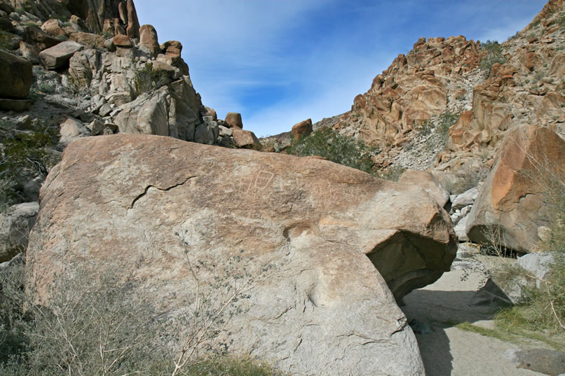 As we wander up the canyon we come to this boulder with two natural steps that provide easy access to the panel along the top.