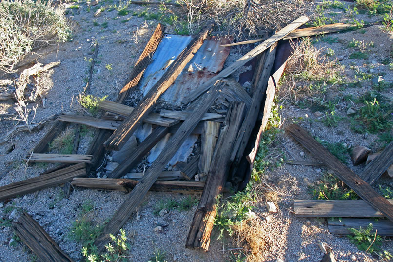 Nearby is the distinctive ruin of a small outhouse.