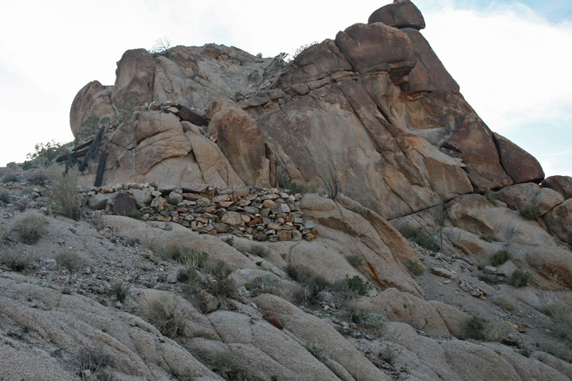 Near the crest of the hill is a stacked stone landing and what appears to be the remains of a crude upper tramway tower.