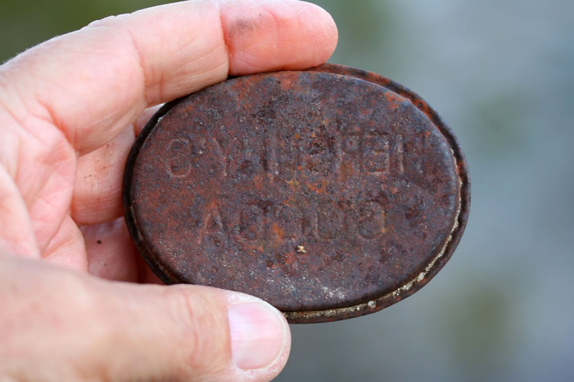 In that smaller can scatter we found the lid to a Hershey's Cocoa tin.  However, since the top is too rusted to read, you have to look at it reversed on the under side of the lid!