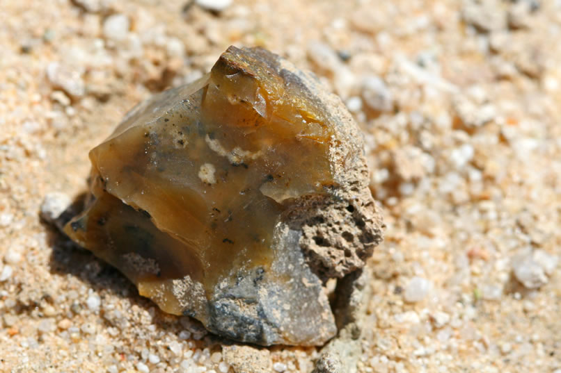 After some wandering around, Mohave decides to start hiking back to camp.  It's a long way and it's hot.  Niki and Jamie decide to move a little further west and continue to look for any evidence of the Pinto Culture.  After a bit of wandering, we start to find some jasper, agate and other crypto-crystalline chunks that aren't from any local areas.