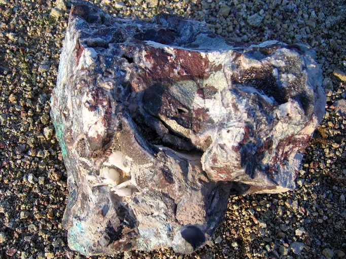 This small boulder was not only copper stained but it also had pockets of quartz crystals and bladed barite crystals.