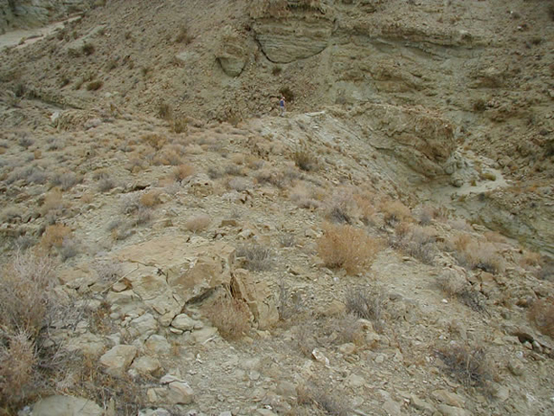 Jamie negotiates a rugged ridge in search of that pesky geocache.