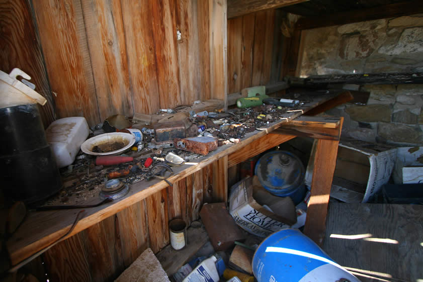 The shed is totally full of junk!  We've heard the story that a pound of mercury, which would have been used in the recovery of fine placer gold, was found in the shed not too long ago.