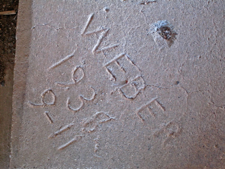This inscription, dated September 11, 1938, gives us an idea of when the concrete foundation in the workroom was probably poured.