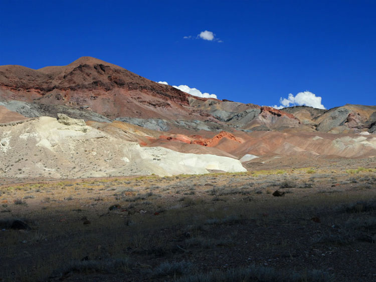 This historic road proves to be quite colorful.  It's been recently graded and we make good time toward the top of the pass.