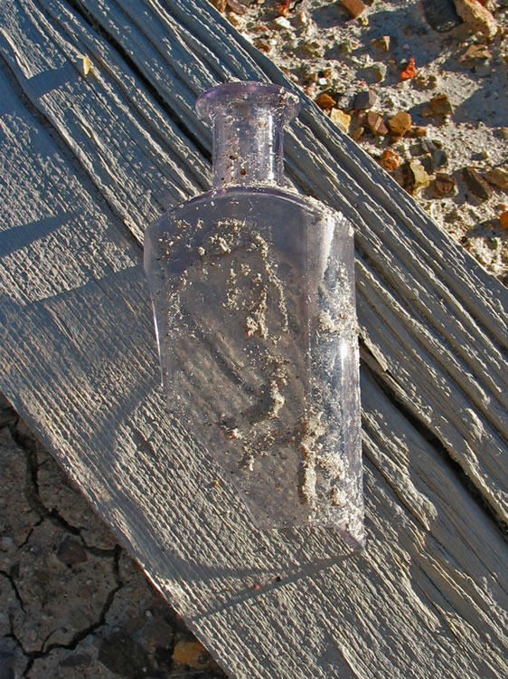 A delicate purple tinged bottle fragment.