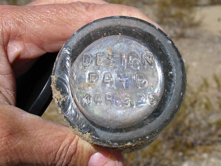 The March 3, '25 date stamped on the bottom of a broken bottle surprises us a bit.  Old mine records show that the Rex operated from 1934 to 1951.  Of course initial prospecting would have taken place at an earlier date.