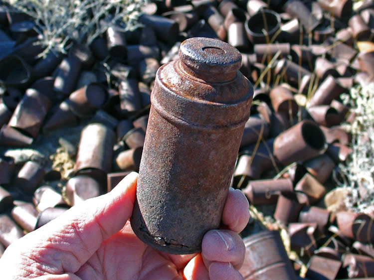 Possibly an old talcum or tooth powder tin.