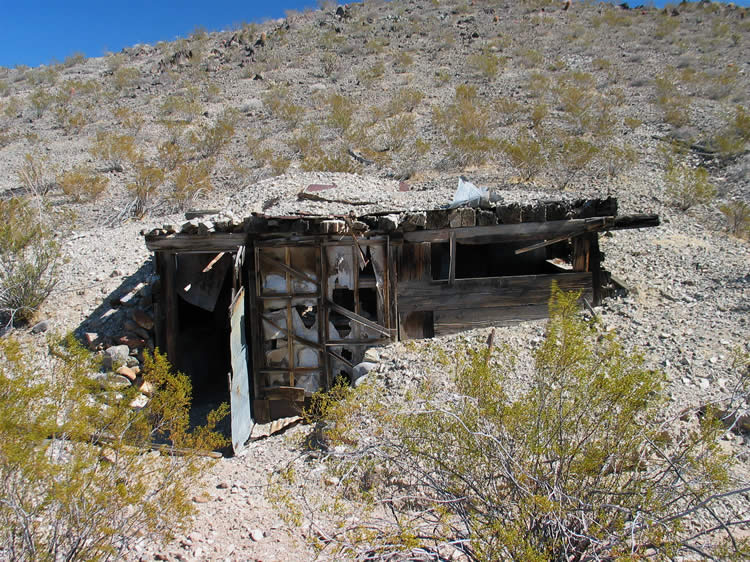 This little dugout is about halfway between the cabins and the mine.  Could it have been used to store blasting powder and supplies?