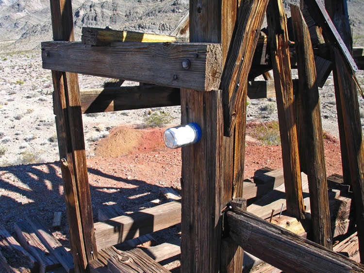 Notice the glass jar nailed to the headframe.  It contains the claim papers.