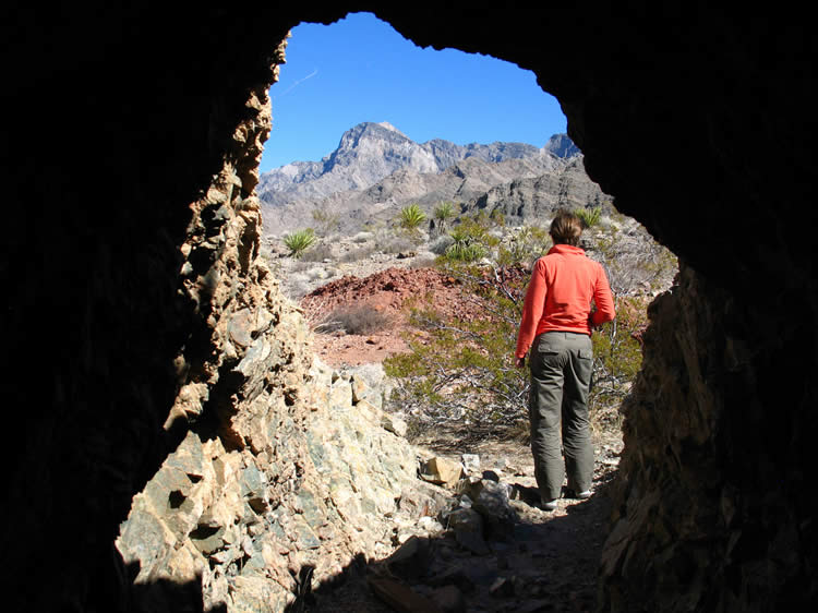 Rather than exit the way we came in, we take a side tunnel that leads to another entrance.  This new exit opens to a stunningly beautiful scene.  Since we're so close to the red mill tailings we decide to go over and check them out.