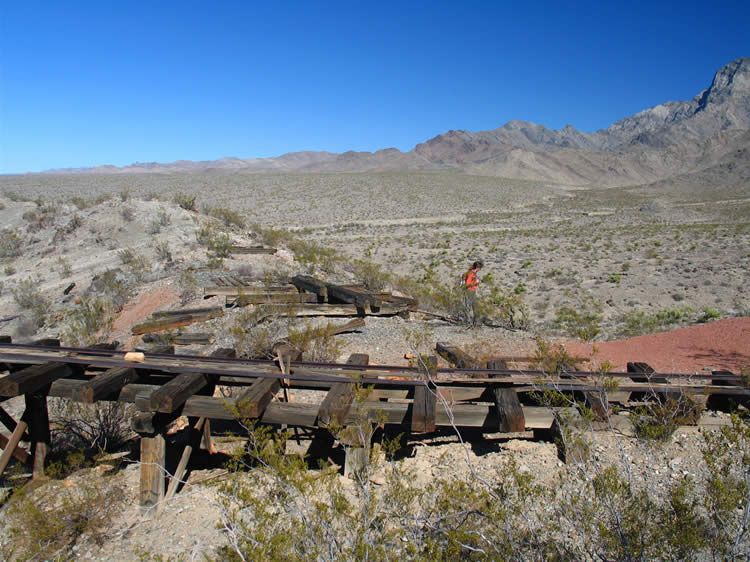 Back up at the trackway to the ore bin we find a stack of old railroad ties and a small structure ruin.