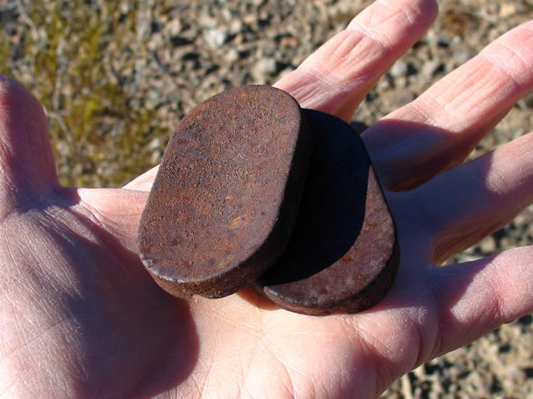 We also find two very distinctive caps that have faint lettering on them that appears to be Cyrillic.  We found the exact same thing at a site in the Ship Mountains.  You can check out a better photo of the lettering from the Ship Mountain trip HERE.  If you can help us with an identification and/or explanation we'd love to hear from you.