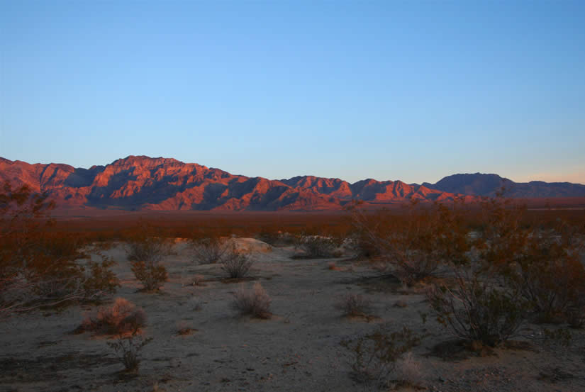 The sunset glow on the mountains behind us.