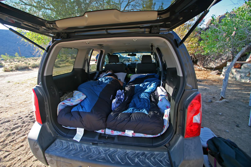Niki claims that the only reason she hasn't gotten up yet is that she's researching the comparison between sleeping in the bed of the Tacoma and the back of the Xterra.  Guess which one is winning!