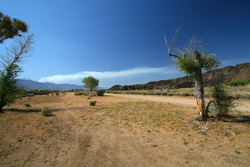 We arrive back at our Little Lake campsite in mid-afternoon and notice the tell-tale plume of smoke from a fire that's just begun in the Sierra foothills.