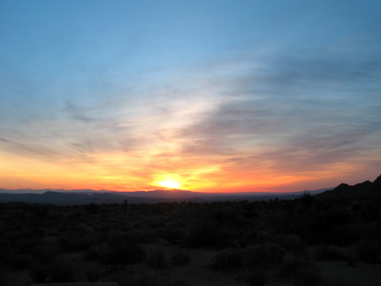 After a very windy night, the glow of sunrise nudges us awake.