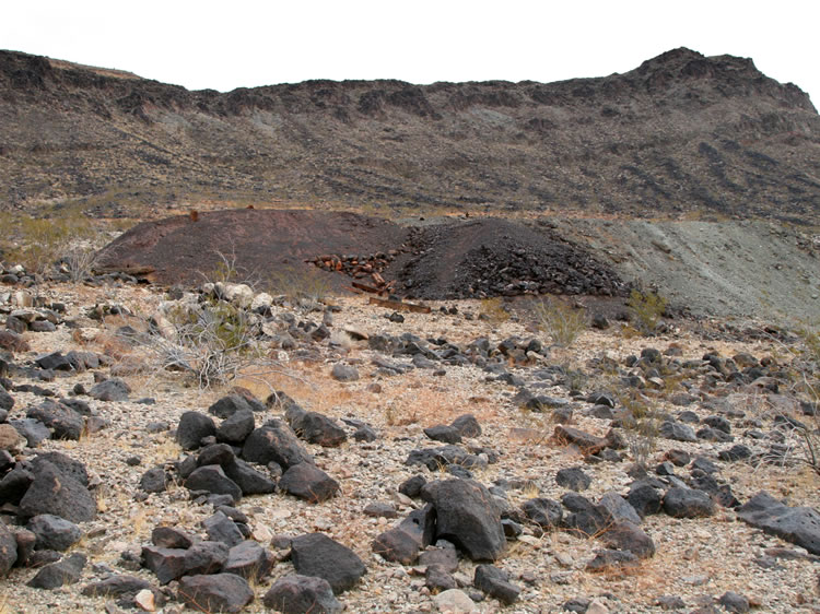 Looking back at the tailings piles as we descend.