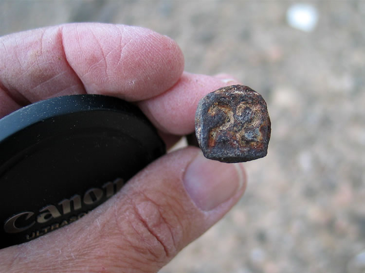 This one is stamped "22," which would be 1922.  It's a year older than the "23" that she found at the Skeleton Cabin site in Scanlon Gulch.  That one had a round shaft, whereas this one has a square shaft.  These historic artifacts should be left in place for the enjoyment of others who might explore this location.