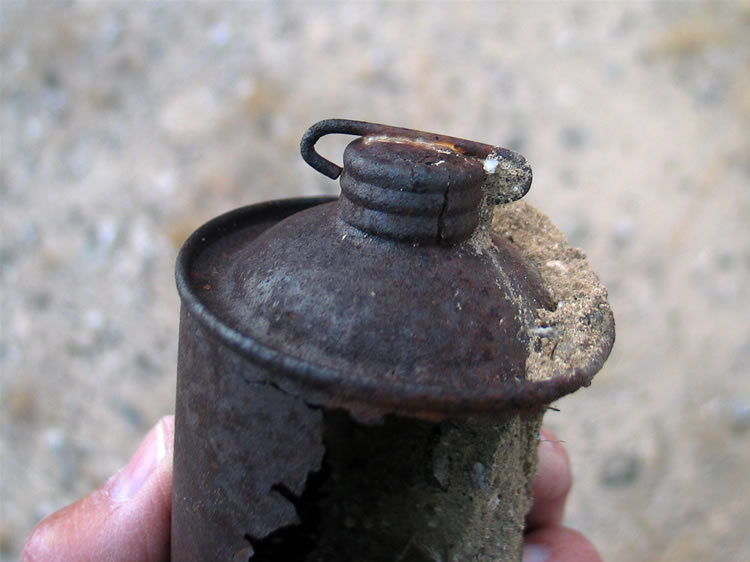 A can with an unusual cap.