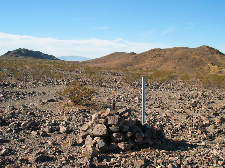 As we wander to the east of the ruin to see if we can find anything else, Niki locates a corner marker.