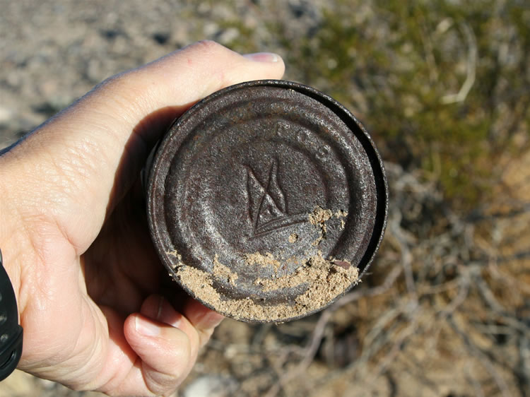These unusual incised marks are on both the top and bottom of the can.  It's almost as if someone used them to identify their canned goods so that other miners wouldn't eat them!