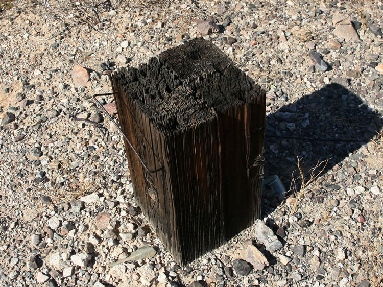A sturdy anvil stump made up of four separate pieces of wood.