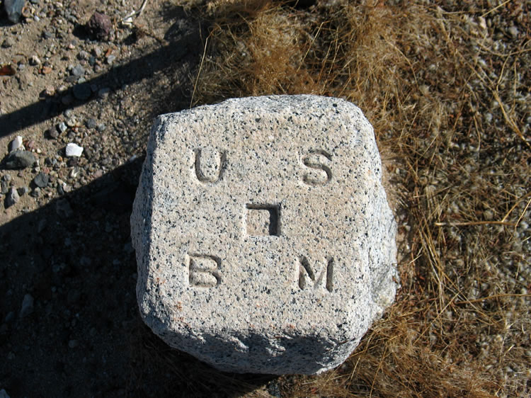 Here's a closer look.  These "chiseled square" style bench marks predate the use of the brass discs which began to be used in 1904.  These older style markers are from the late 1800's and, although rare, are most often found near old town sites constructed when the railroads were first built.  We have seen a similar one at the old site of Argos, which has also been razed.