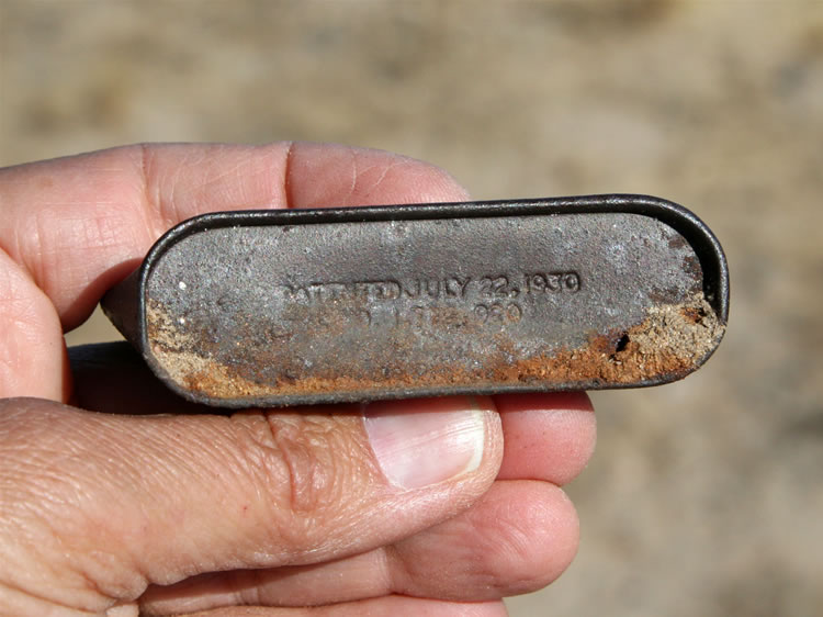 The patent date, July 22, 1930, is stamped on the bottom of the tin.   The following photo is of one of the better preserved tins of this type.