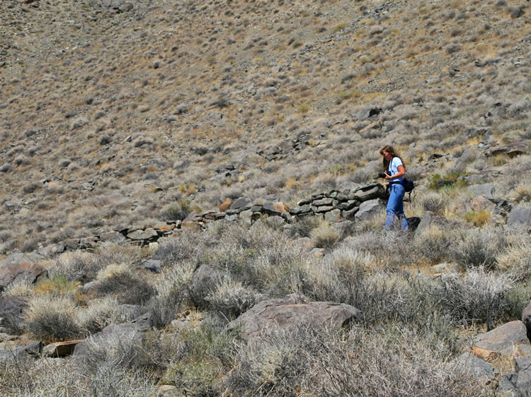 Niki locates several of the stone foundations.