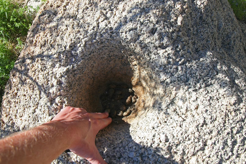 Niki's hand adds a bit of scale.  It appears that this mortar has seen a lot of use.