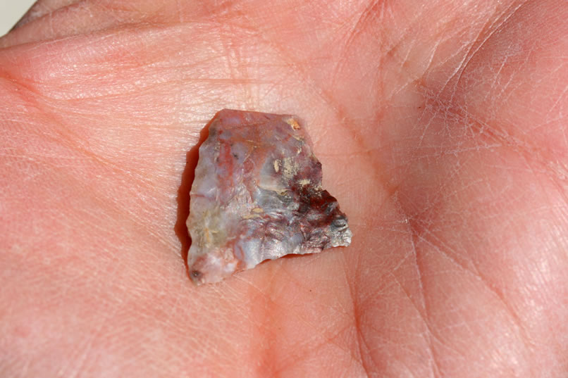 Some scattered lithic material turns up as we approach the overhanging shelter.