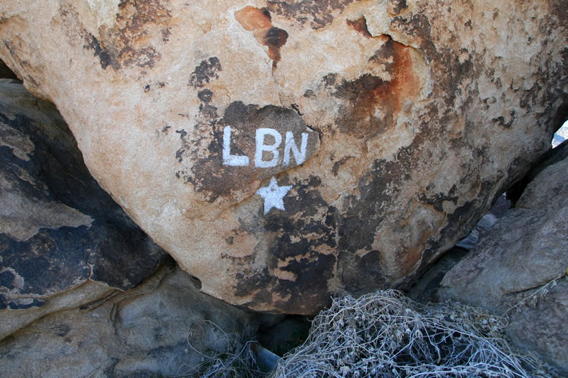 Near the trash scatter we find a seemingly modern bit of spray paint on a boulder.